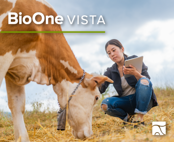 BioOne VISTA. An agronomist holding a tablet in one hand examines a cow in a field.