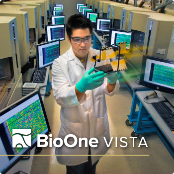 BioOne VISTA. A researcher with the Human Genome project looks at results, standing in the middle of an aisle lined with machines on both sides.
