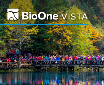 Autumn trees reflected in water with a wooden bridge and a crowd of tourists